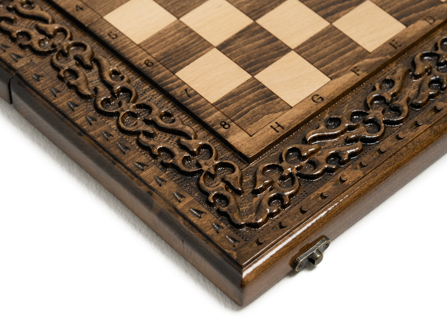 Detailed wooden chess pieces arranged on the board