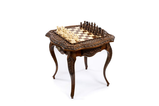 Hand-carved luxury chess table by ImperialChess, showcasing detailed artisanal craftsmanship and elegant design.