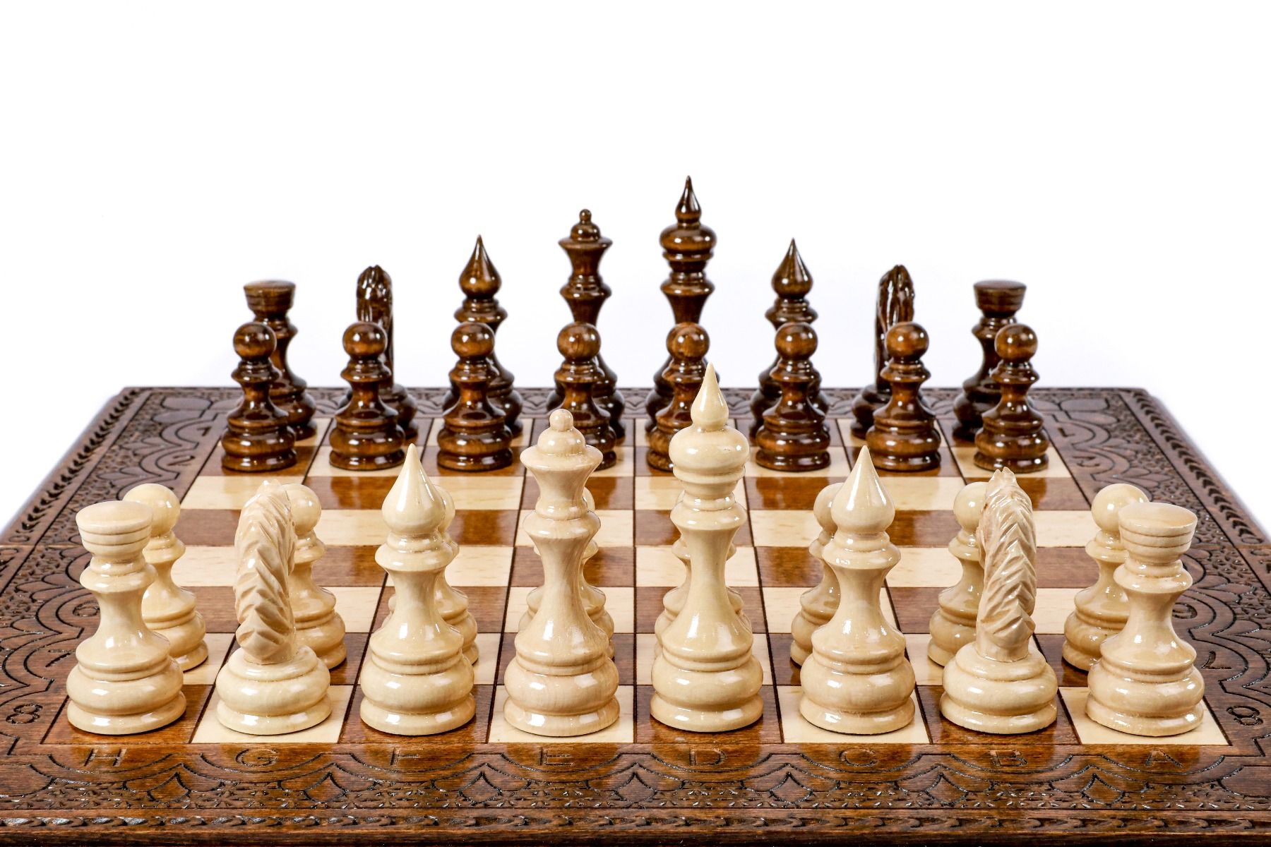 Experience the beauty of a handcrafted wooden chess set, where traditional forms are enhanced with unique design elements for a truly classic game.